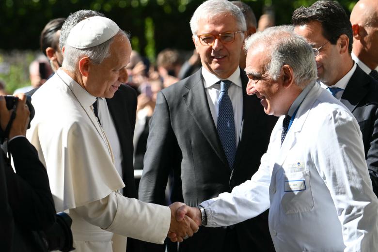 Pope Leo XIV leaves the Vatican by car before being admitted to Rome's Gemelli University Hospital for an operation to remove a lump from his lung, in the Vatican on 13 October 2026.  (Photo by Tiziana FABI / AFP)