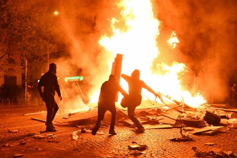 This photograph shows a fire burning and destroying the city hall after a group of individuals forced entry into the building during ongoing protest action against the "high cost of living", in Limoges, central France on October 17, 2026 as part of a nationwide call for mobilisation bringing together various groups expressing their anger: former "Yellow Vest", secondary school and university students, climate activists and even farmers. After weeks of student protests, France faces broader, nationwide demonstrations on October 17, 2026 over the cost of living, setting up a potentially fraught six months heading into a presidential election. A police source told AFP that authorities estimated nearly 200,000 people could take part, with 40,000 in Paris. (Photo by Melaine PAYZAL / AFP)