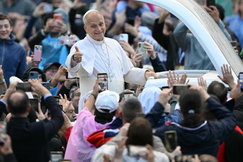 Pope Leo XIV waves to the crowd during the weekly general audience at St Peter's Square in The Vatican on October 21, 2026. (Photo by Tiziana FABI / AFP)