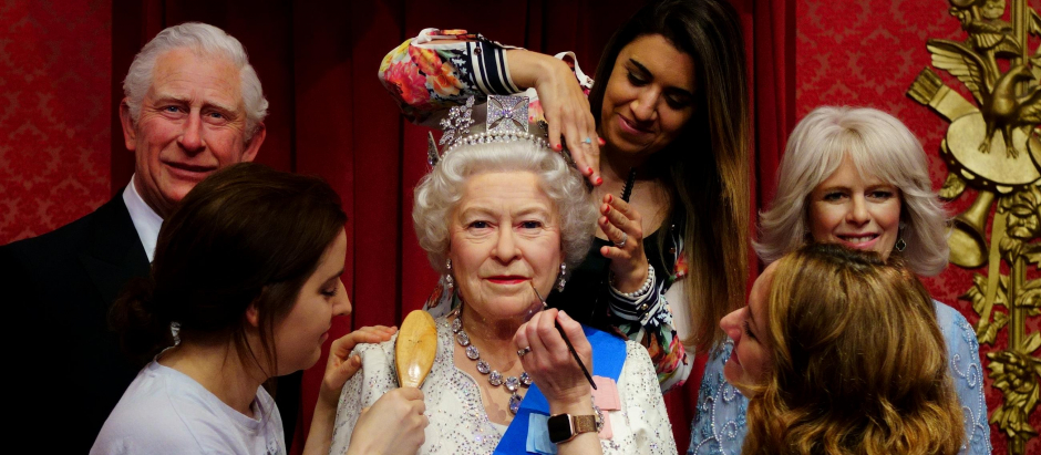 Studio artists Luisa Compobassi (left), Caryn Mitanni (back) and Jo Kinsey (right) make their final touches to the wax figure of Queen Elizabeth II at Madame Tussauds London ahead the Platinum Jubilee celebrations. Picture date: Wednesday May 25, 2022.