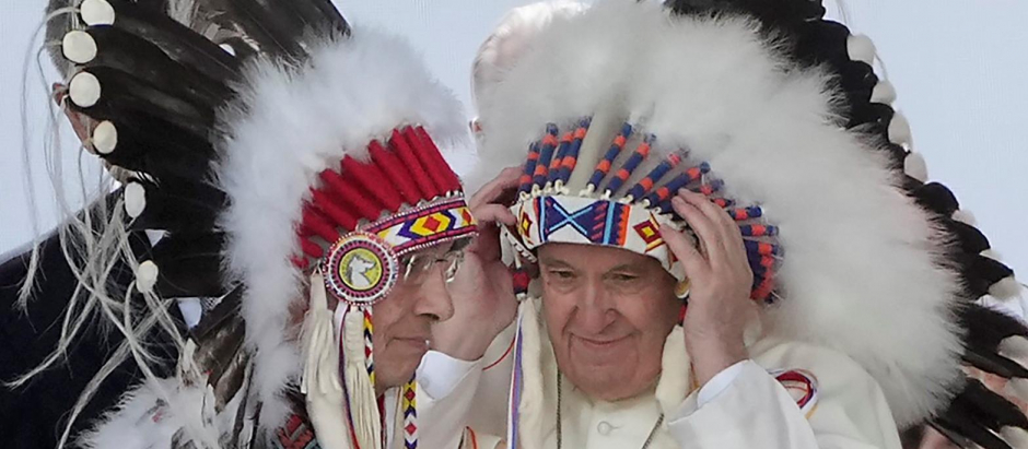 Pope Francis with a traditional headdress during a ceremony in Maskwacis, Alberta, as part of his papal visit across Canada on Monday, July 25, 2022.