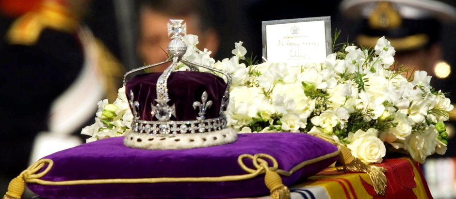 The Koh-i-noor, or "mountain of light," diamond, set in the Maltese Cross at the front of the crown made for Britain's late Queen Mother Elizabeth, is seen on her coffin, along with her personal standard, a wreath and a note from her daughter, Queen Elizabeth II, as it is drawn to London's Westminster Hall in this April 5, 2002 file photo. We've got it, we're keeping it. That was the essence of the British government's attitude in responding to Pakistan's request for the return of the fabled Koh-i-noor diamond 30 years ago, according to confidential papers released Friday, Dec. 29, 2006.  (AP Photo/Alastair Grant, File)