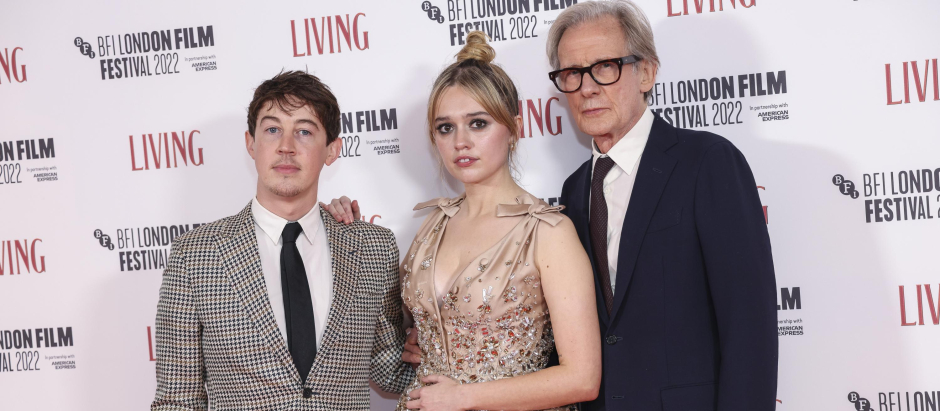 Alex Sharp, from left, Aimee Lou Wood and Bill Nighy pose for photographers upon arrival for the premiere of the film 'Living' during the 2022 London Film Festival in London, Sunday, Oct. 9, 2022.  *** Local Caption *** .