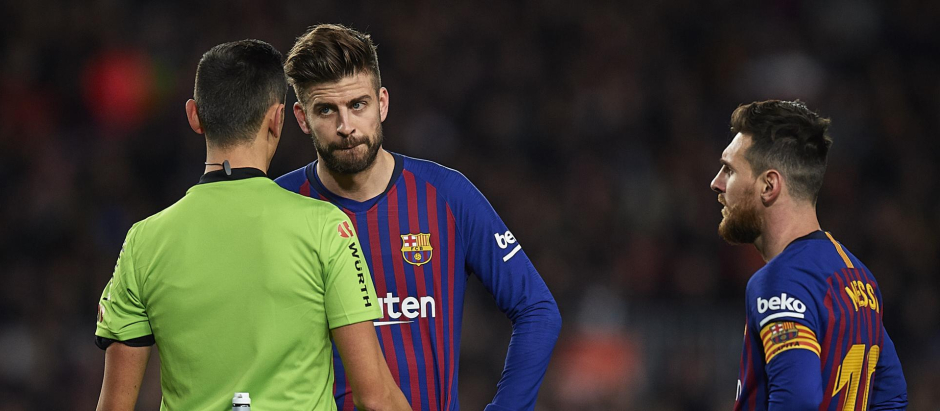 Piqué y Messi, en un partido del Barcelona del año 2018