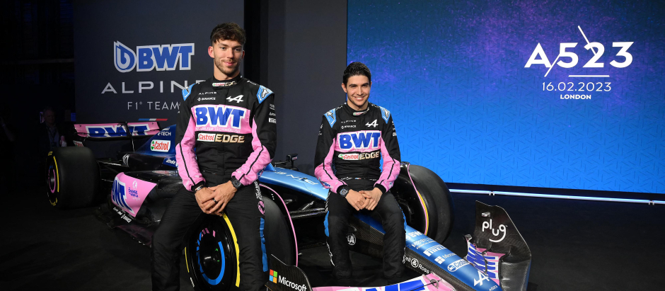 French drivers Pierre Gasly (L) and Esteban Ocon pose with their new BWT Alpine A523 Formula One racing car during the team's 2023 season launch, in London on February 16, 2023. (Photo by Daniel LEAL / AFP)