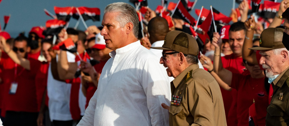 Cuban President Miguel Diaz-Canel (L) and former President Raul Castro (R) attend the celebrations for the 69th anniversary of the Moncada Barracks assault in Cienfuegos, Cuba, on July 26, 2022. (Photo by Yamil LAGE / AFP)