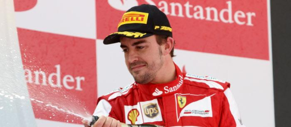 Ferrari driver Fernando Alonso of Spain celebrates on the podium after winning the Formula One Spanish Grand Prix, at the Catalunya racetrack in Montmelo, near Barcelona, Spain, Sunday, May 12, 2013.