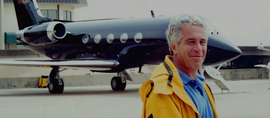 Jeffrey Epstein standing in front of one of his private aircraft.