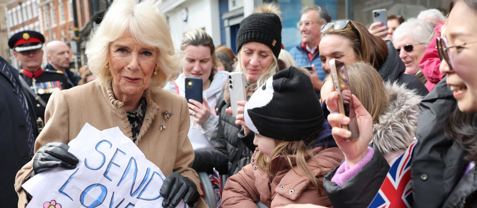 Queen Camilla receives a message of support for the Princess of Wales from well-wishers during a visit to the Farmers' Market in The Square, Shrewsbury, in Shropshire. Picture date: Wednesday March 27, 2024.