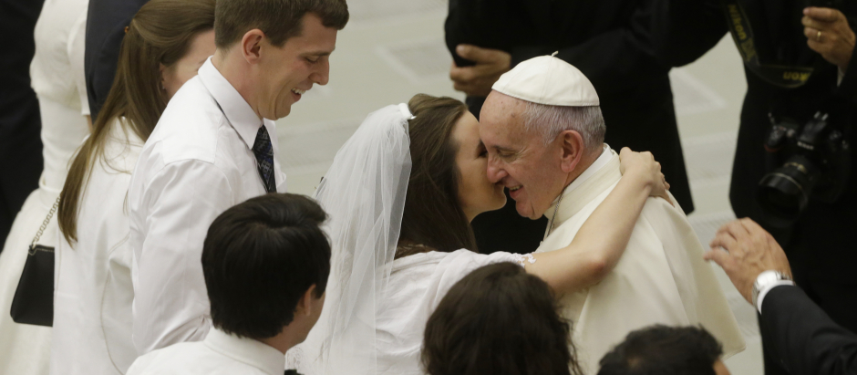 Pope Francis greets newlyweds during the general audience in the Paul VI hall at the Vatican, Wednesday, Aug. 5, 2015.