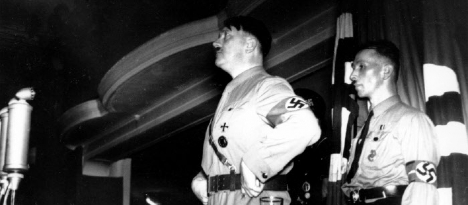 German chancellor and Nazi party leader Adolf Hitler stands at the podium as he addresses leaders and members of the Nazi party organization in Munich, Germany on Nov. 8, 1934. They are gathered in the Munich restaurant where Hitler staged the unsuccessful coup attempt known as the Beer Hall Putsch to take control of the Bavarian state government on Nov. 8, 1923. This gathering, eleven years later, is in honor of the Nazis who were killed in the failed "putsch."  (AP Photo)