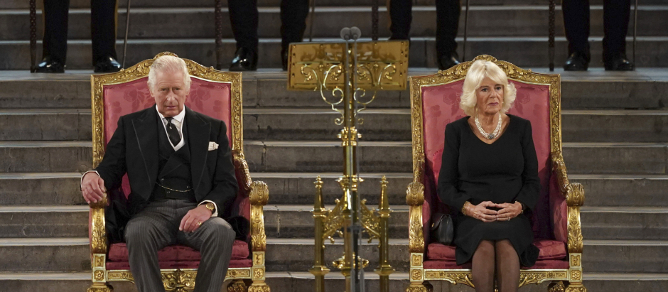 Britain's King Charles III, left, and the Queen Consort sit at Westminster Hall, where both Houses of Parliament are meeting to express their condolences following the death of Queen Elizabeth II, at Westminster Hall, in London, Monday, Sept. 12, 2022. Queen Elizabeth II, Britain's longest-reigning monarch, died Thursday after 70 years on the throne. (Stefan Rousseau/Pool Photo via AP) *** Local Caption *** .