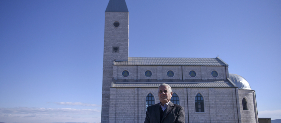 Ismet Sopi poses in front of the church of the village of Llapushnik on February 2, 2023. - In an austere church perched above a picturesque valley in central Kosovo, Ismet Sopi recounts how his family hid their Catholic faith for centuries, after converting to Islam during the Ottoman conquest of the Balkans.
For generations, his forebears maintained their religious convictions secretly, he explains, until 2008 when Sopi and his family openly embraced their Catholicism and were baptised together. (Photo by Armend NIMANI / AFP)