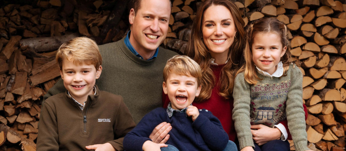 Undated handout image provided by Kensington Palace of the 2020 Christmas card of Britain's Prince William, and Kate Middleton, Duchess of Cambridge, which features an image taken in the autumn by photographer Matt Porteous showing Britain's Prince William, and Catherine, Duchess of Cambridge, posing with their children, Prince Louis, Princess Charlotte and Prince George at Anmer Hall, in Norfolk, Britain.