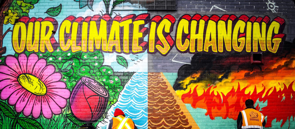 Grafiti reivindicando el cambio climático en Glasgow, celebrando la próxima COP26