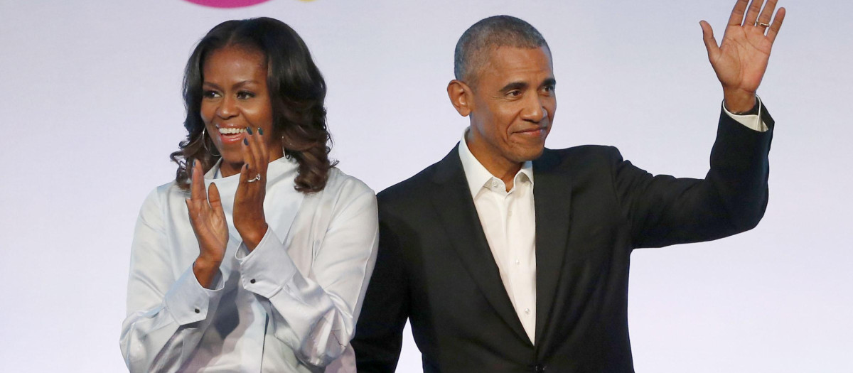 FILE - In this Oct. 31, 2017, file photo, former President Barack Obama, right, and former first lady Michelle Obama appear at the Obama Foundation Summit in Chicago.