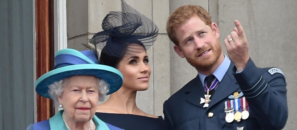 Queen Elizabeth II , with Prince Harry and Meghan Markle during the RAF Centenary at BuckinghamPalace, London