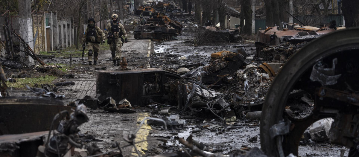 DEDS NOTE: GRAPHIC CONTENT - Lifeless bodies of men, some with their hands tied behind their backs, lie on the ground in Bucha, Ukraine, Sunday, April 3, 2022. Associated Press journalists in Bucha, a small city northwest of Kyiv, saw the bodies of at least nine people in civilian clothes who appeared to have been killed at close range. At least two had their hands tied behind their backs. (AP Photo/Vadim Ghirda)