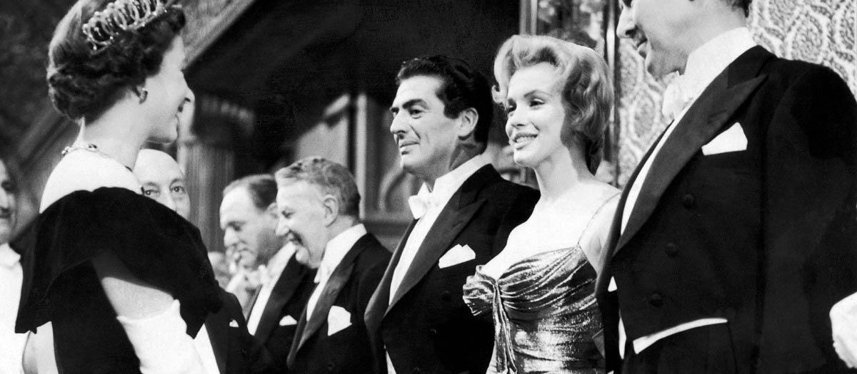 American film actress Marilyn Monroe meets Queen Elizabeth II at the Royal Command Film Performance at Leicester Square in London. 29th October 1956. (Photo by Daily Herald/Mirrorpix/Mirrorpix via Getty Images)