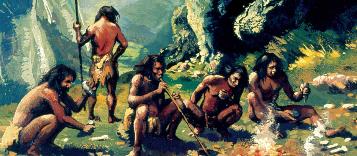 Un grupo de homo sapiens reunidos frente al fuego