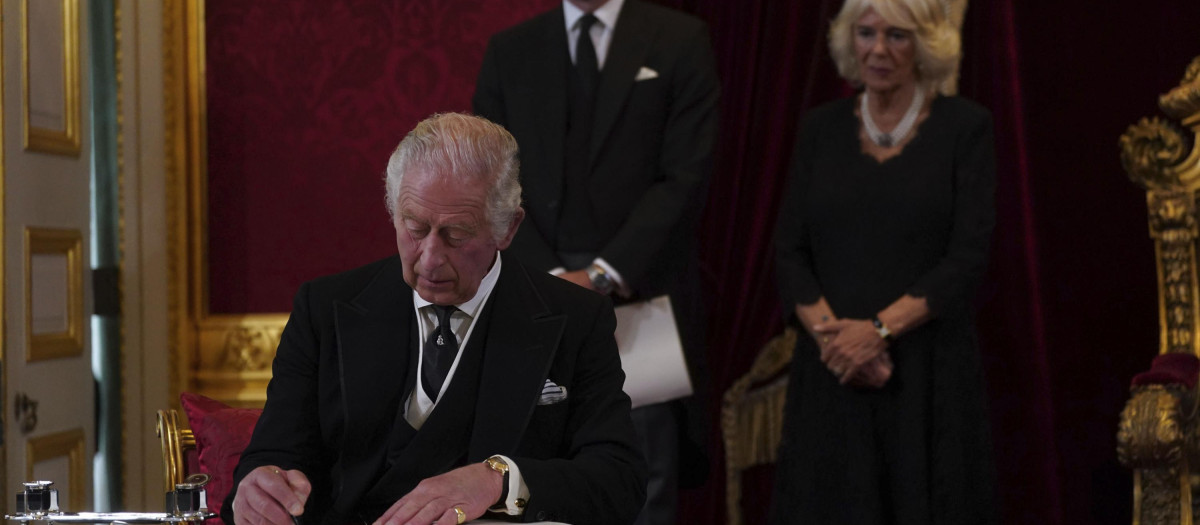 King Charles III signs an oath to uphold the security of the Church in Scotland during the Accession Council at St James's Palace, London, Saturday, Sept. 10, 2022, where King Charles III is formally proclaimed monarch. (Victoria Jones/Pool Photo via AP) *** Local Caption *** .
