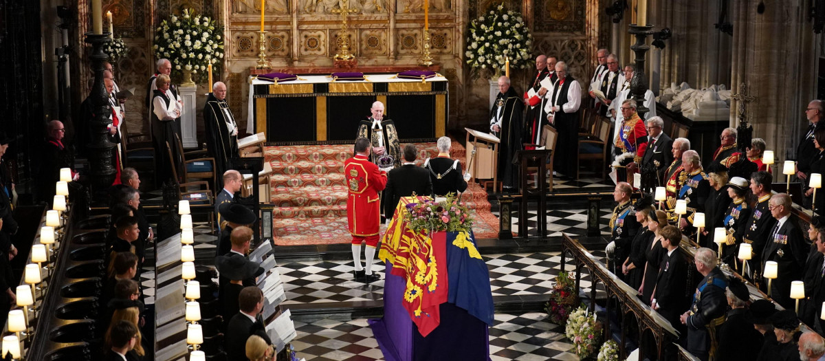The Imperial State Crown is removed from the coffin of Britain's Queen Elizabeth II during a committal service at St George's Chapel, Windsor Castle, in Windsor, England, Monday, Sept. 19, 2022. (Joe Giddens/Pool Photo via AP) *** Local Caption *** .