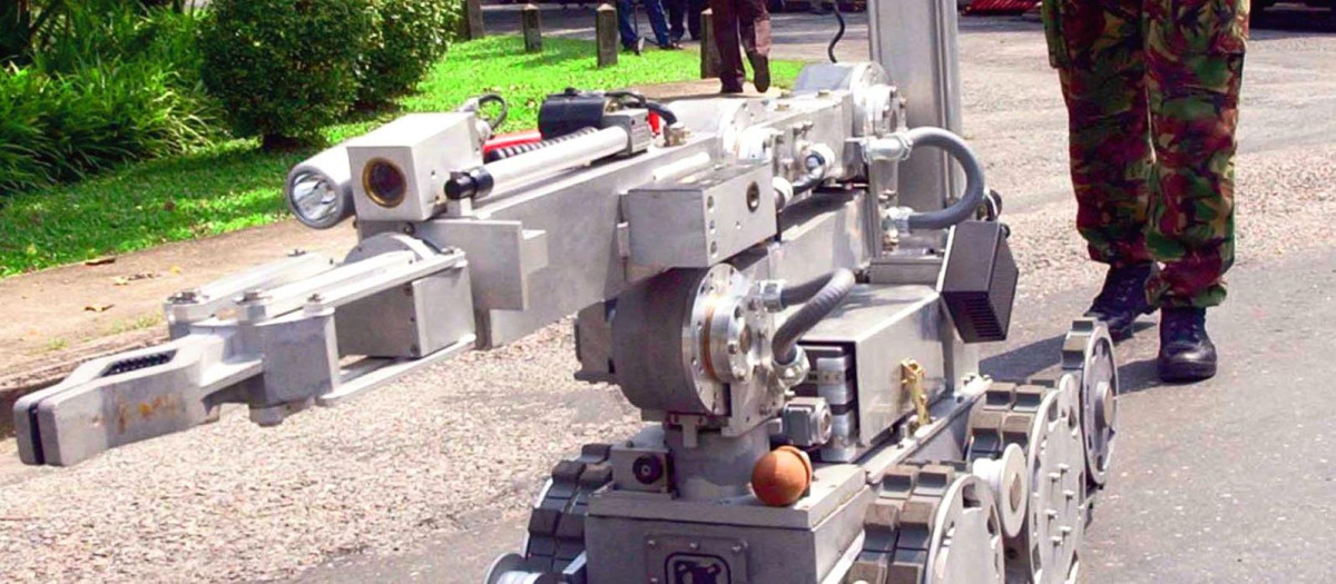 A training official operates a remote control robot part of new bomb disposal equipment just supplied to the Thai police force at the Rose Garden Resort Thursday, Oct. 31, 2002 in Nakhon Pathom, Thailand, where the second round of Sri Lanka peace talks began Thursday. The talks, brokered by Norway, are being hosted by Thailand in an effort to end the 19-year separatist conflict in Sri Lanka that has claimed 65,000 lives. (AP Photo/Sakchai Lalit)