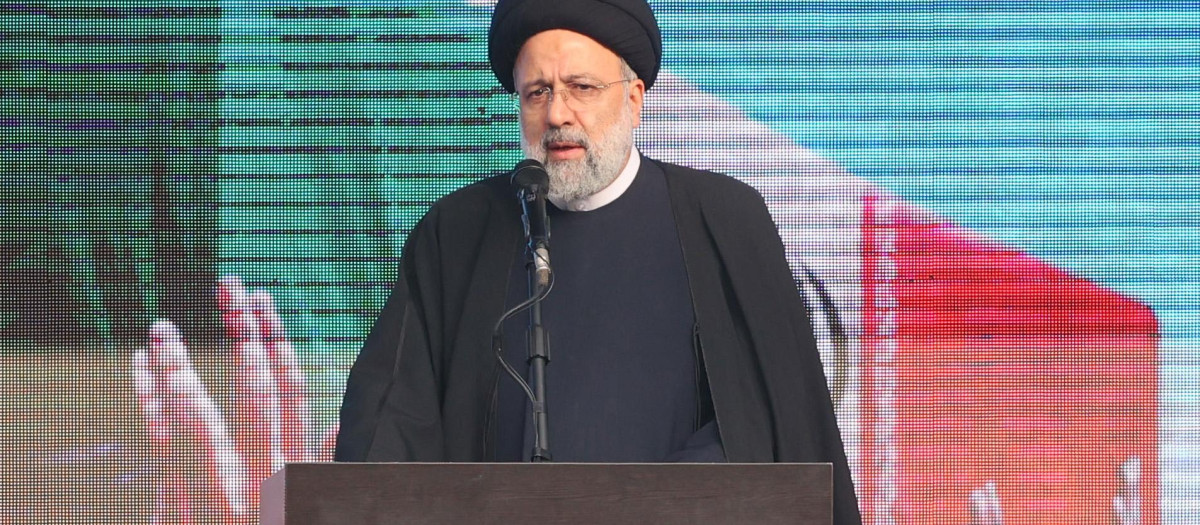 Iran's President Ebrahim Raisi speaks in Tehran on December 27, 2022 following a funeral procession carrying the remains of 200 Iranian soldiers recovered from former battlefields of the Iran-Iraq war (1980-1988). (Photo by AFP)