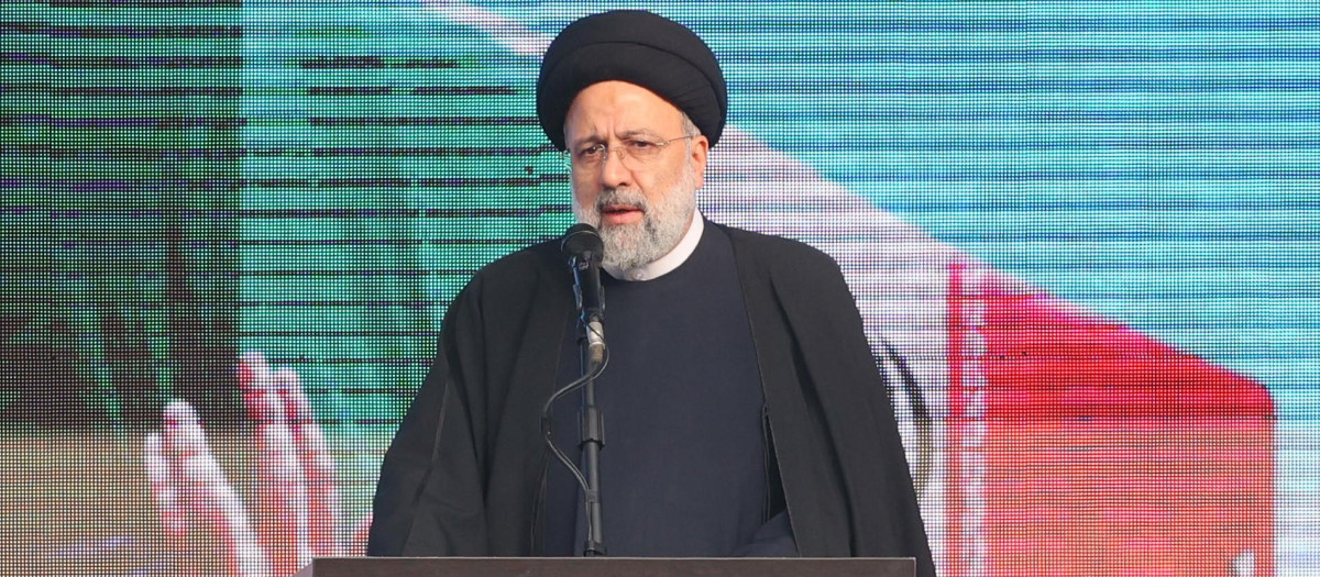Iran's President Ebrahim Raisi speaks in Tehran on December 27, 2022 following a funeral procession carrying the remains of 200 Iranian soldiers recovered from former battlefields of the Iran-Iraq war (1980-1988). (Photo by AFP)