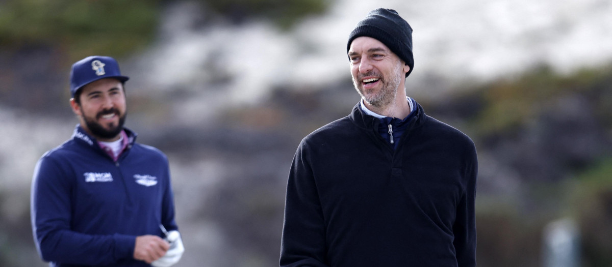 Mark Hubbard and Pau Gasol walk up the third hole during the first round of the AT&T Pebble Beach Pro-Am at