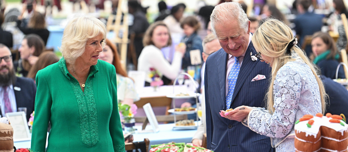 Britain's Prince Charles, center, and Camilla, Duchess of Cornwall attend a Big Jubilee Lunch in London, Sunday, June 5, 2022,