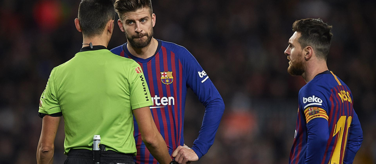 Piqué y Messi, en un partido del Barcelona del año 2018