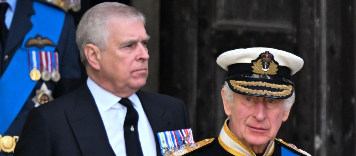 Britain's King Charles III and Prince Edward during the carriage procession for Queen Elizabeth II's state funeral from London to Windsor on 19 September 2022