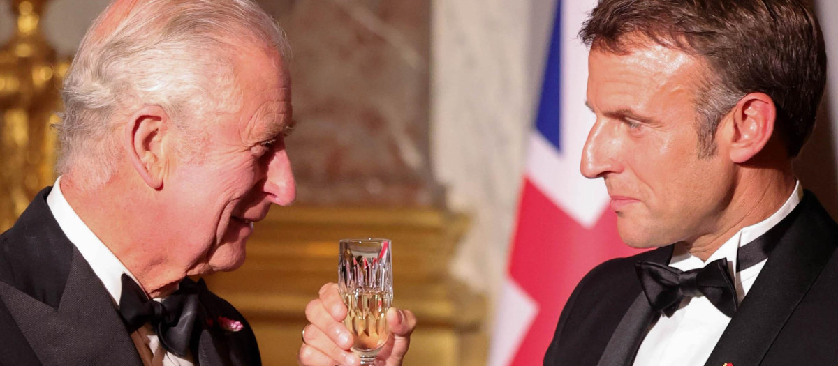 Britain's King Charles with French President Emmanuel Macron during a state dinner in Versailles, near Paris, on the first day of their State visit to France, September 20, 2023.