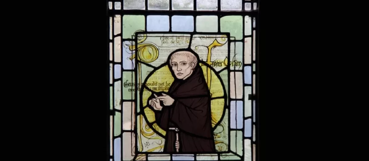 Guillermo de Ockham en un vidriera en una iglesia Surrey