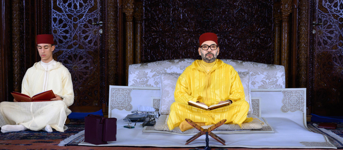 King Mohammed VI of Morocco (centre), and his son Crown Prince Moulay Hassan (or El Hassan, left, pray during a religious vigil at the Mohammed V Mausoleum in Rabat, Morocco, on October 25, 2023, in commemoration of the 25th year of the passing away of the late King Hassan II, The 25th year should be in July 2024, but this is now the