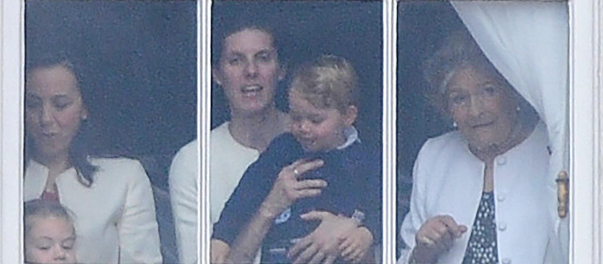 Prince George watches The Trooping the Colour during the Queen's birthday parade with his nanny Maria Teresa Turrion Borrallo in London, UK on the 13th June 2015.