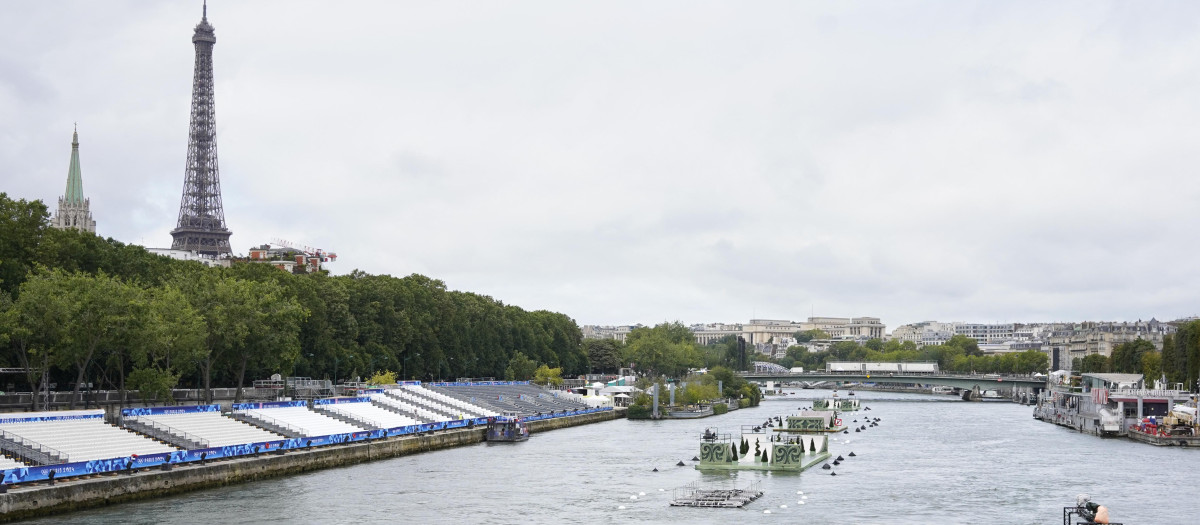 View of the quays of the Seine river from the Invalides bridge a few days before the opening ceremony of the Olympic Games in Paris, France, on July 23, 2024. Eiffel Tower in the background. (Photo by Laure Boyer / Hans Lucas / Hans Lucas via AFP)