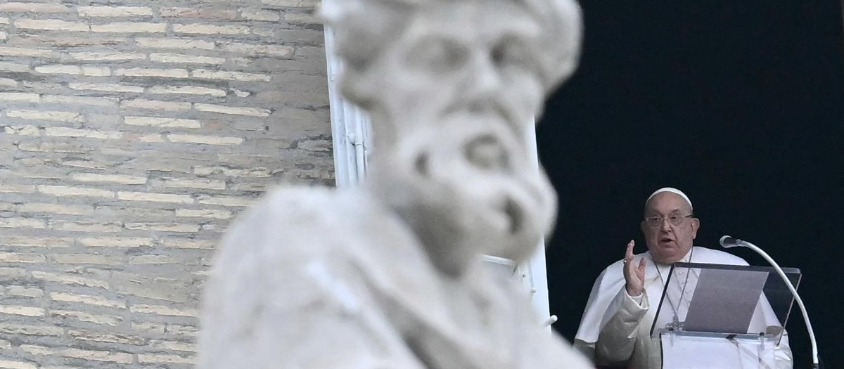 Pope Francis blesses the crowd from the window of the apostolic palace overlooking St. Peter's square for the Angelus prayer on January 19, 2025 in The Vatican. (Photo by Filippo MONTEFORTE / AFP)