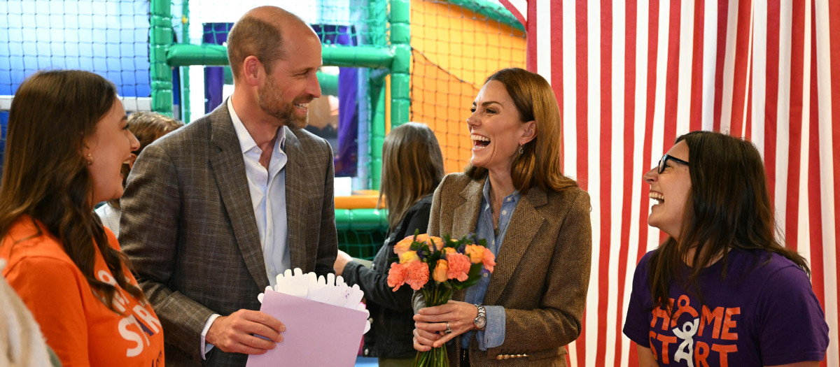 Britain's Prince William, Prince of Wales and Britain's Catherine, Princess of Wales react during their visit to the soft play area inside the Aros Hall community hub in Tobermory, on the Isle of Mull, western Scotland on April 29, 2025. (Photo by Oli SCARFF / POOL / AFP)