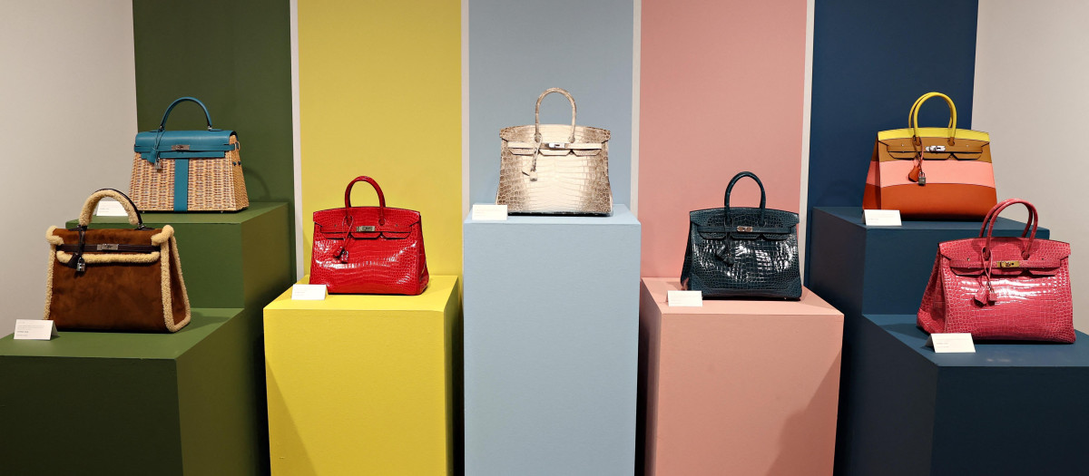 (FILES) This photograph shows Hermes Birkin bags on display during a press preview of the Luxury Week at Christie's, in New York City on June 4, 2021. Auction house Sotheby's said on June 5, 2025, that the first Birkin bag that was designed by French luxury brand Hermes for actress Jane Birkin in 1984, will be auctioned in Paris on July 10, 2025. (Photo by Cindy Ord / GETTY IMAGES NORTH AMERICA / AFP)