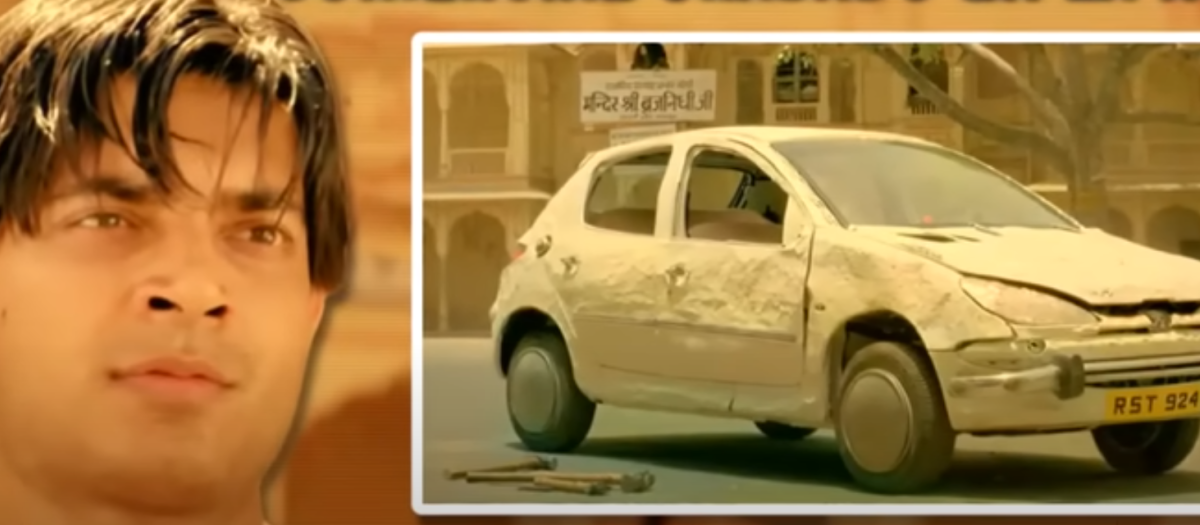 El protagonista del anuncio junto a su bello coche