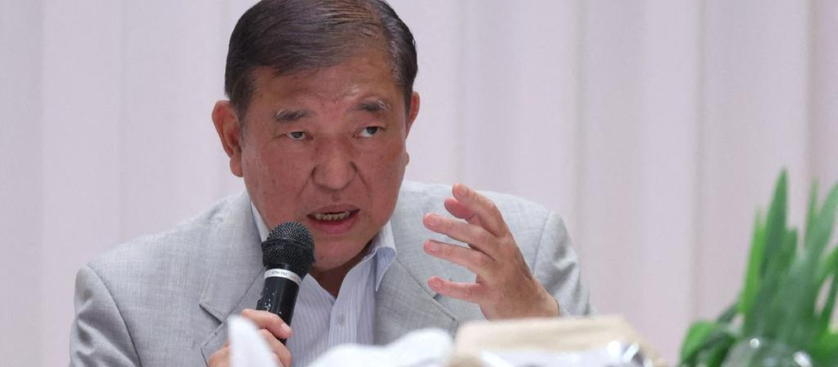 Japanese Prime Minister Shigeru Ishiba exchanges views with local rice farmers in Daisen City, Akita Prefecture, Japan, on July 14, 2025. ( The Yomiuri Shimbun ) (Photo by Nidenori Nagai / The Yomiuri Shimbun via AFP)