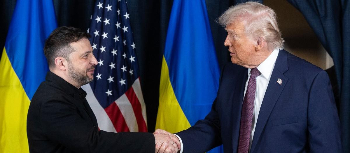 A picture obtained from the X account of Volodymyr Zelensky on January 22, 2026, shows Ukraine's President Volodymyr Zelensky (L) and US President Donald Trump shaking hands during their bilateral meeting on the sidelines of the World Economic Forum (WEF) annual meeting in Davos. (Photo by Handout / X account of Volodymyr Zelensky / AFP) / RESTRICTED TO EDITORIAL USE - MANDATORY CREDIT "AFP PHOTO / X ACCOUNT OF VOLODYMYR ZELENSKY" - NO MARKETING NO ADVERTISING CAMPAIGNS - DISTRIBUTED AS A SERVICE TO CLIENTS