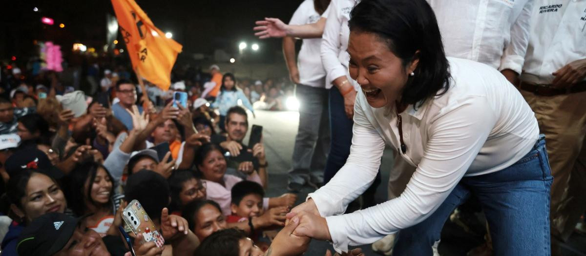Peru's presidential candidate Keiko Fujimori, for the Fuerza Popular party, greets supporters during a campaign rally at the Peru-Korea Esplanade in the Ventanilla district, Peru on April 2, 2026. Peru will hold presidential elections on April 12. (Photo by Connie FRANCE / AFP)