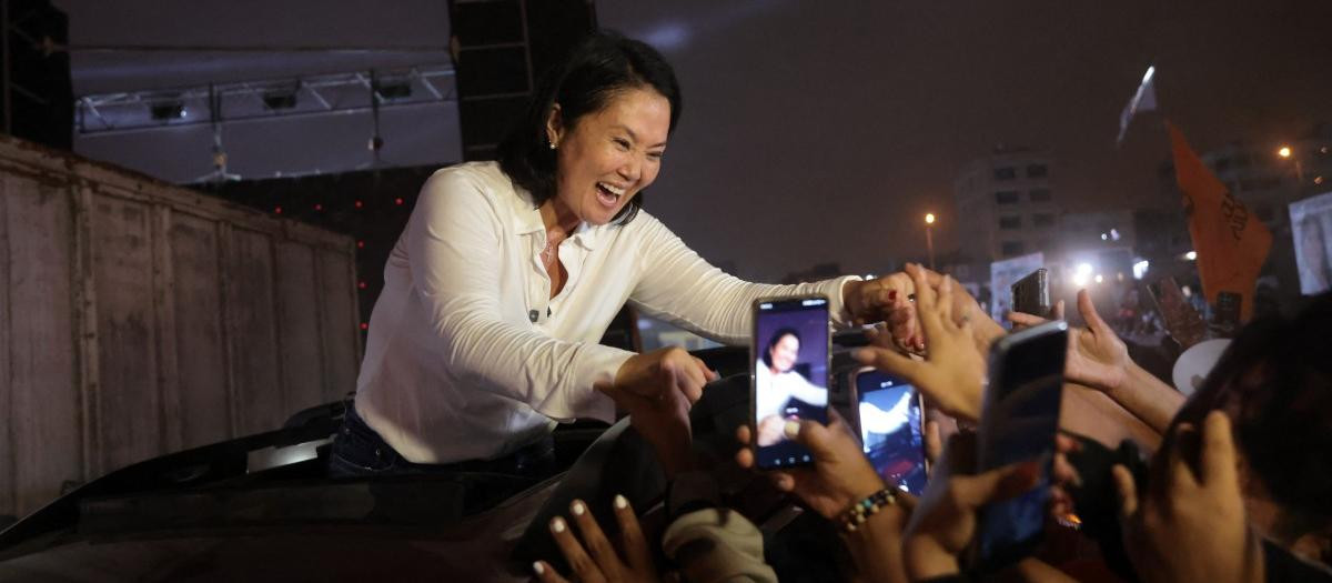 Peru's presidential candidate Keiko Fujimori, for the Fuerza Popular party, greets supporters after a campaign rally at the Peru-Korea Esplanade in the Ventanilla district, Peru on April 2, 2026. Peru will hold presidential elections on April 12. (Photo by Connie FRANCE / AFP)