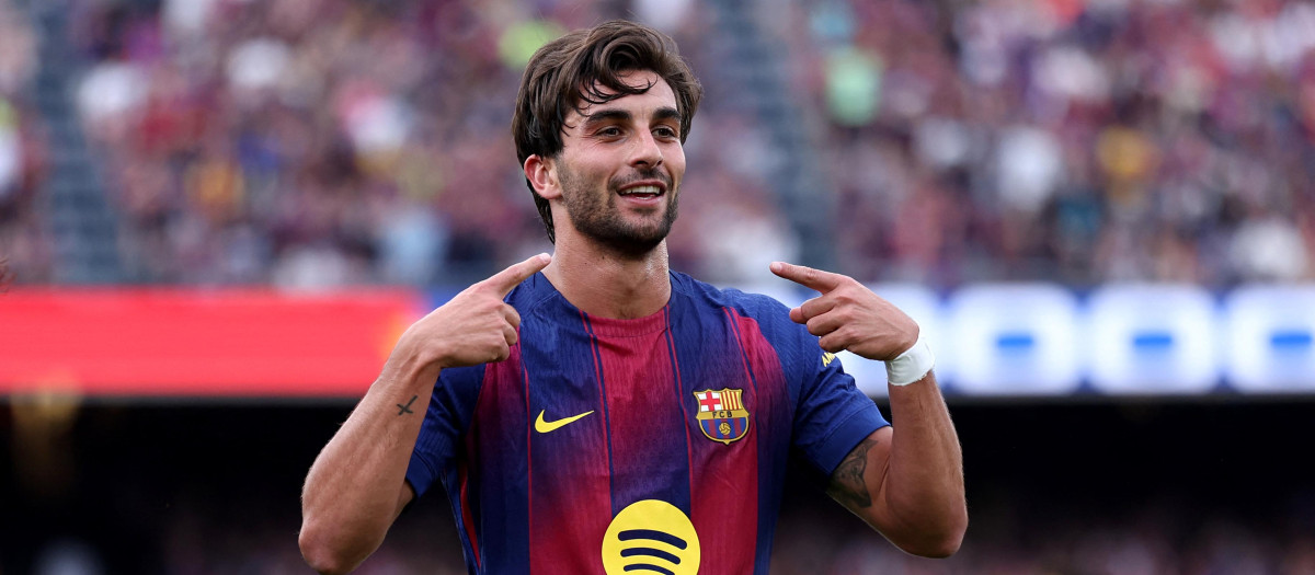 Barcelona's Spanish forward #07 Ferran Torres celebrates scoring his team's second goal during the Spanish league football match between FC Barcelona and RCD Espanyol at the Camp Nou stadium in Barcelona on April 11 , 2026. (Photo by Josep LAGO / AFP)