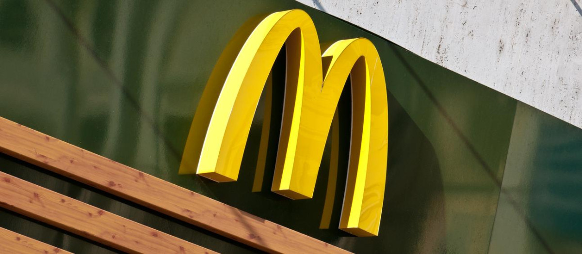 Bratislava, Slovakia - October 2, 2011: McDonald's Golden Arches Logo from a Mc Caf&egrave; store in central square of Bratislava, capital of Slovakia. This food chain entered in Eastern European countries just after the fall of Berlin Wall in 1989