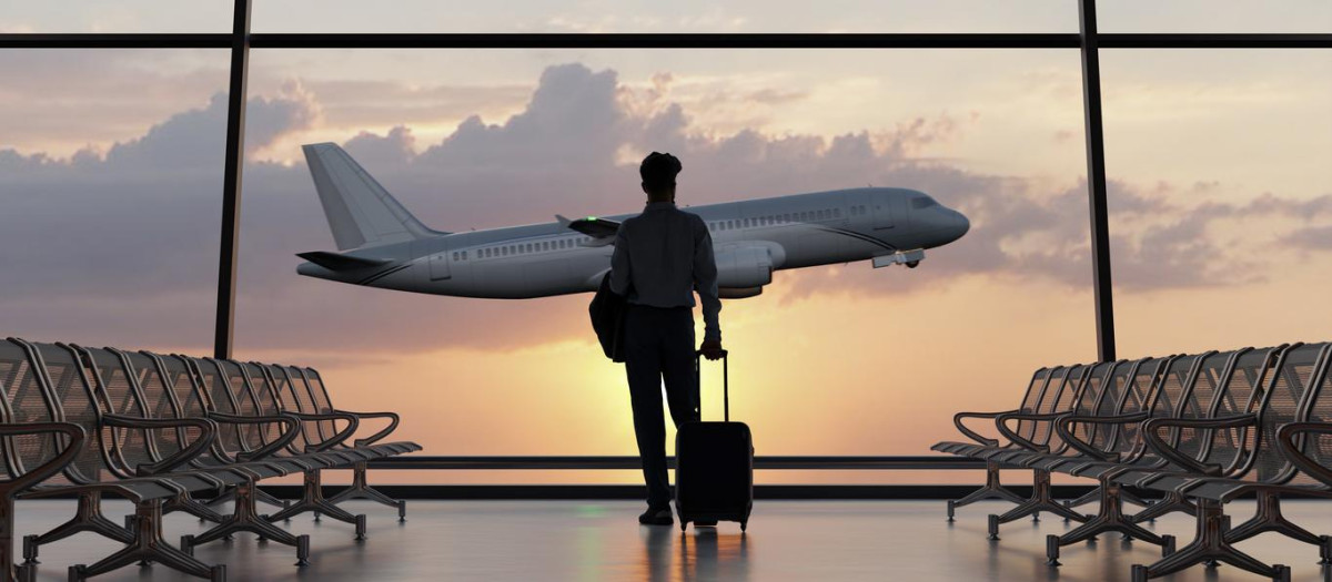 Silhouette of a man walking in the airport as the plane takes off during sunset. 3D illustration