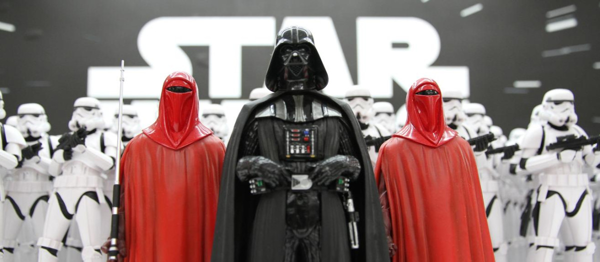Tokyo, Japan - April 14, 2016: Toy Stormtroopers lined up in ranks led by Darth Vader and Imperial Guards. The action figures are created by the Kotobukiya Toy company and are from the Star Wars media franchise.